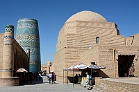 A street in Khiva with Kalta Minor in the background.