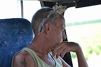 Janne has received an ostrich feather behind the ear instead of a cigarette.
